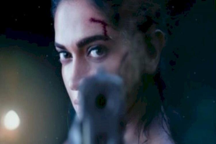 Shah Rukh Khan Shares The First Look Of Deepika Padukone Holding A Gun From 'Pathan'