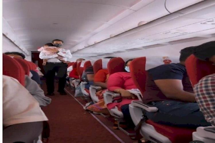 Air India Staff Calms Down A Crying Child In Flight, This Viral Video Will Touch The Heart