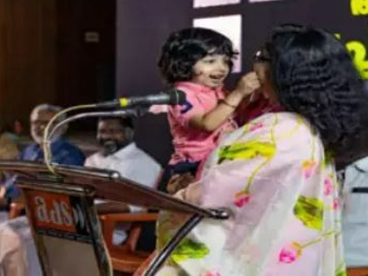 Women IAS in Kerala trolled on social media over giving a speech with son in lap