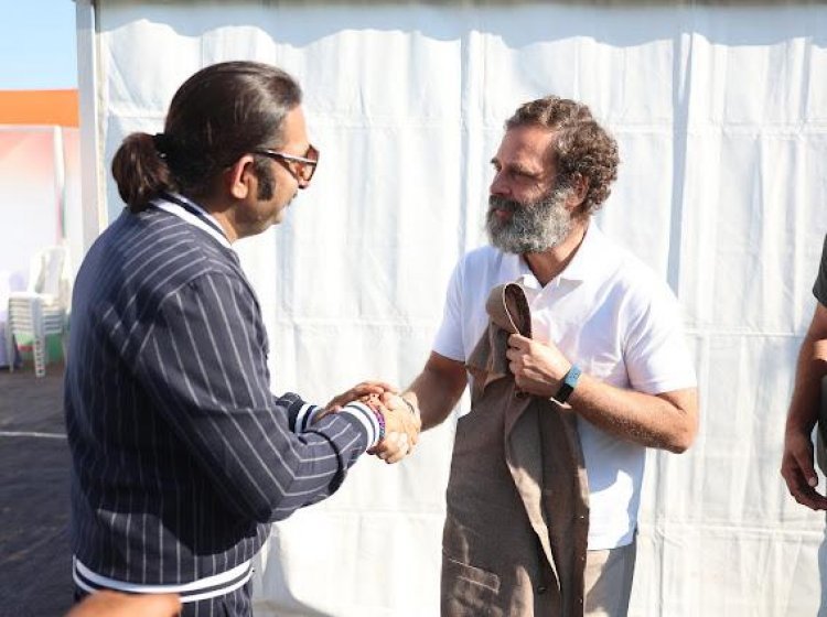 Celebrity fashion designer Himmat Singh presented Khadi designer Nehru jacket to Rahul Gandhi