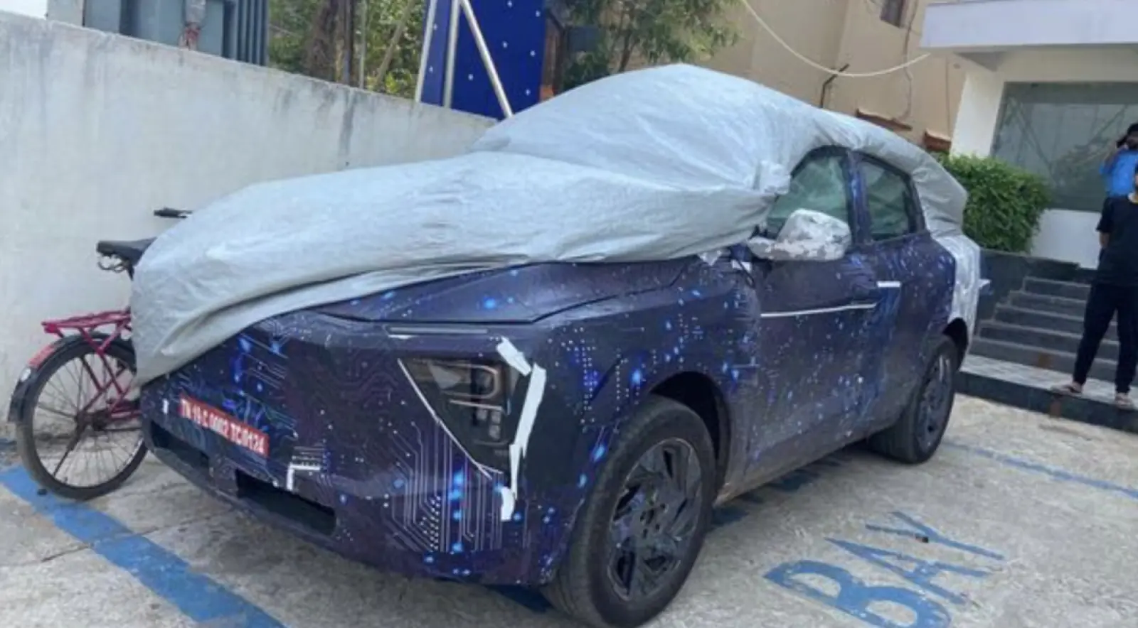 Mahindra XUV.e9 EV spotted while charging, new details revealed