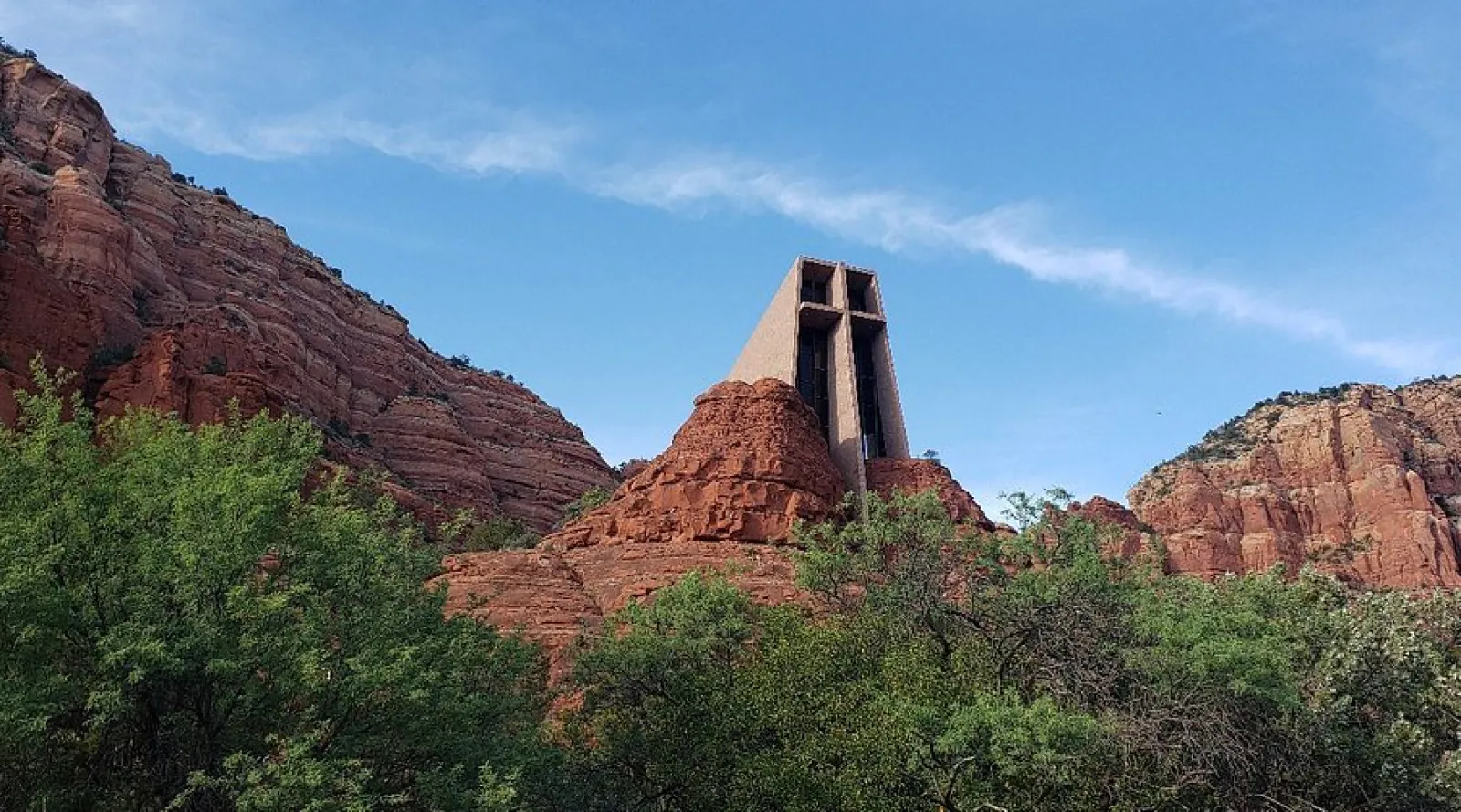 Place of prayer in USA surrounded by red rocks on a high mountain, Chapel of the Holy Cross's history is linked to World War-II